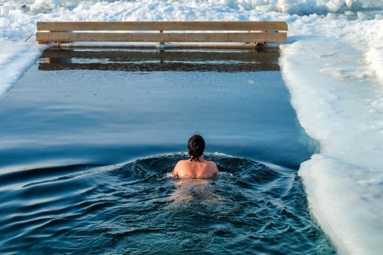 woman experiencing the benefits of a cold water plunge