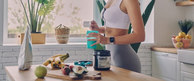 Close-up,Of,Sporty,Woman,Preparing,Protein,Cocktail,In,The,Kitchen