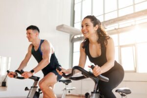 Beautiful,Athletic,Couple,Of,Cyclists,Train,In,The,Fitness,Room