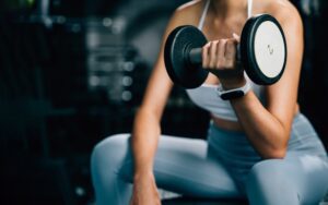 A woman lifting a weight
