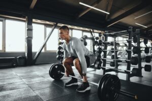 A man lifting weights in a gym