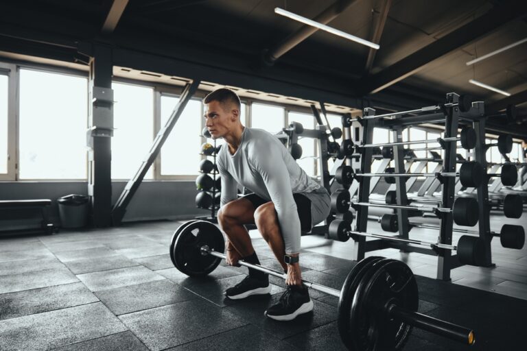 A man lifting weights in a gym