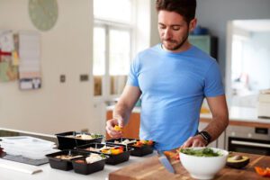 Man cooks high protein meal.
